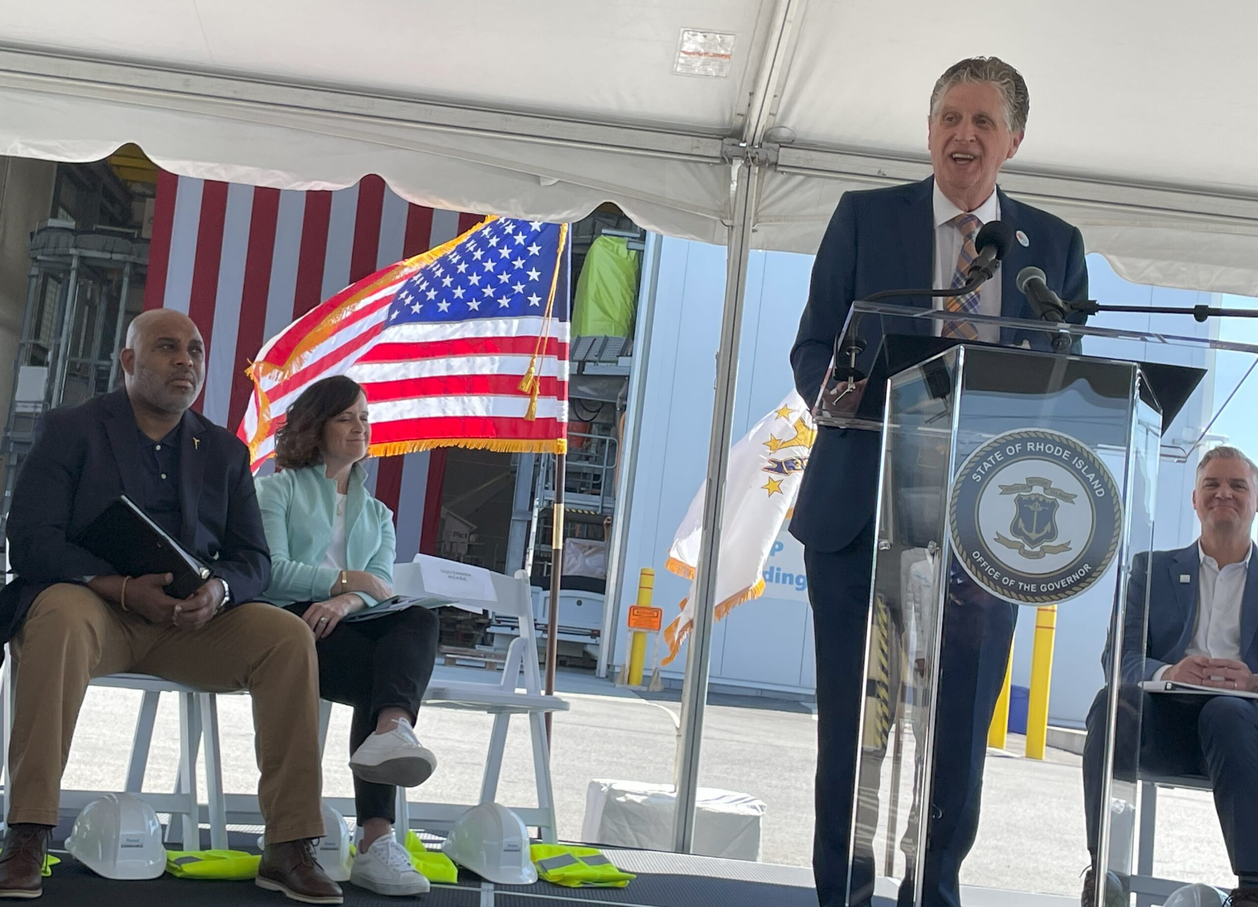 Rhode Island Gov. Dan McKee speaks at an event in June in Providence marking completion of offshore turbine components for the Revolution Wind project. New England’s push into offshore wind comes amid longstanding apprehension by federal regulators and the nation’s electric reliability watchdog over New England’s dependence on natural gas power generation, worrisome when paired with its constrained pipeline capacity during extreme cold. (Robert Zullo/ States Newsroom)