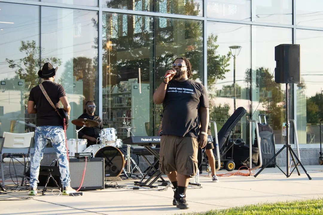 Haneef Salaam, center, has been organizing music and art events at the United Artists Exchange in Wilmington all summer, and city leaders only drew criticism when the latest event drew in an activist message. | SPOTLIGHT DELAWARE PHOTO BY BRIANNA HILL