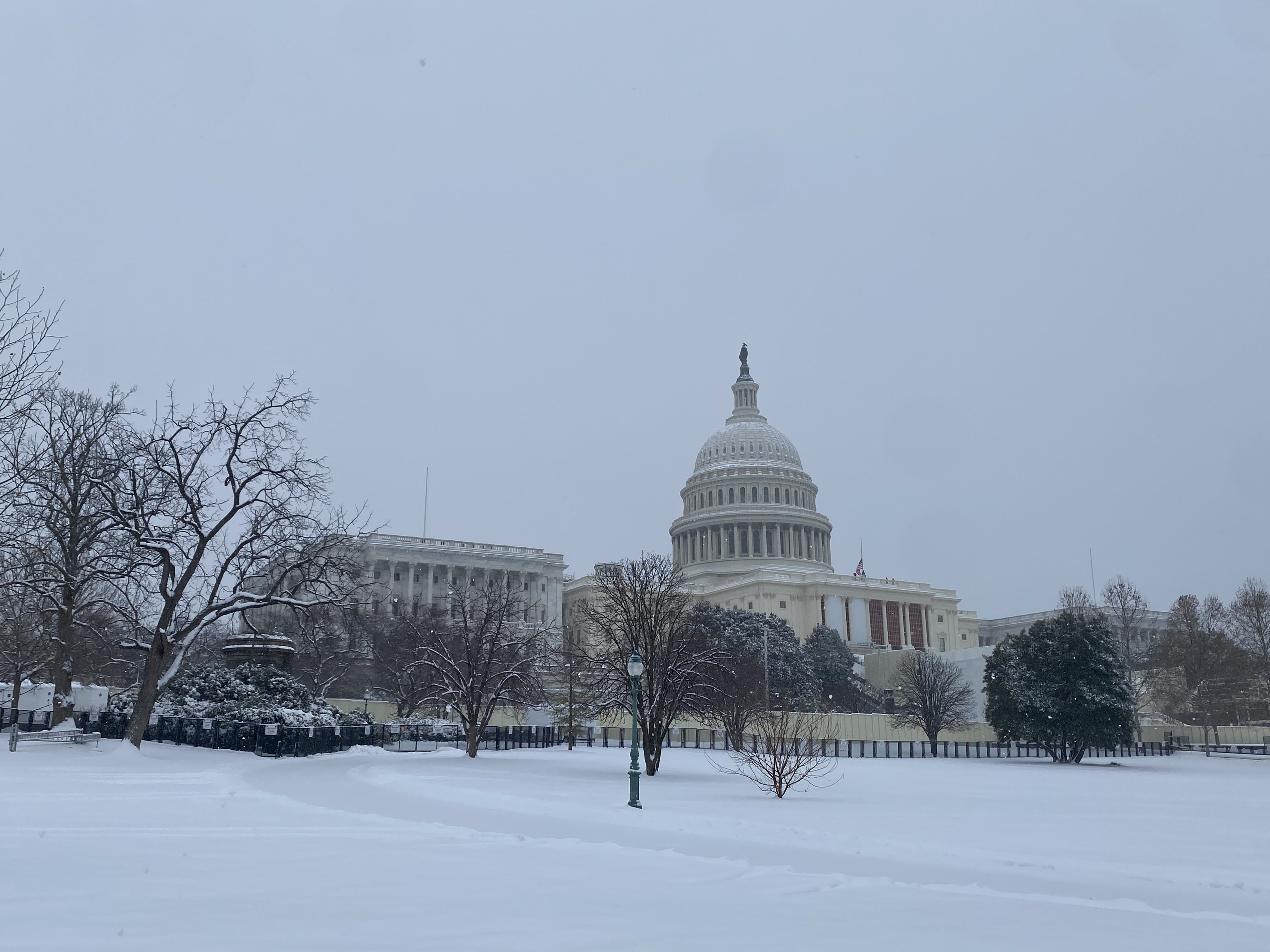 The U.S. Capitol under a blanket of snow on Jan. 6, 2025. (Photo by Jennifer Shutt/States Newsroom)