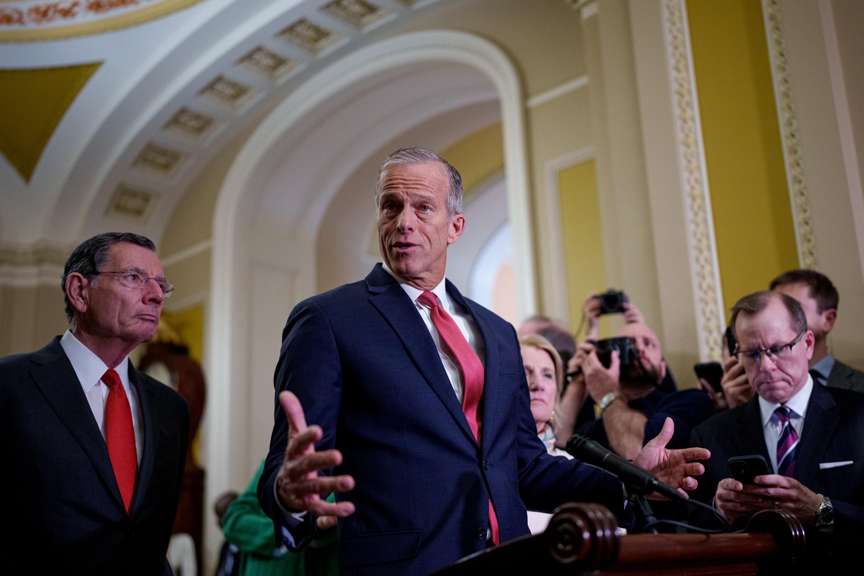 Senate Majority Leader John Thune, R-S.D., center, accompanied by Sen. John Barrasso, R-Wyo., left, and Sen. Shelley Moore Capito, R-W.Va., right, speaks to reporters following a weekly Republican policy luncheon at the U.S. Capitol on Feb. 19, 2025, in Washington, D.C. (Photo by Andrew Harnik/Getty Images)