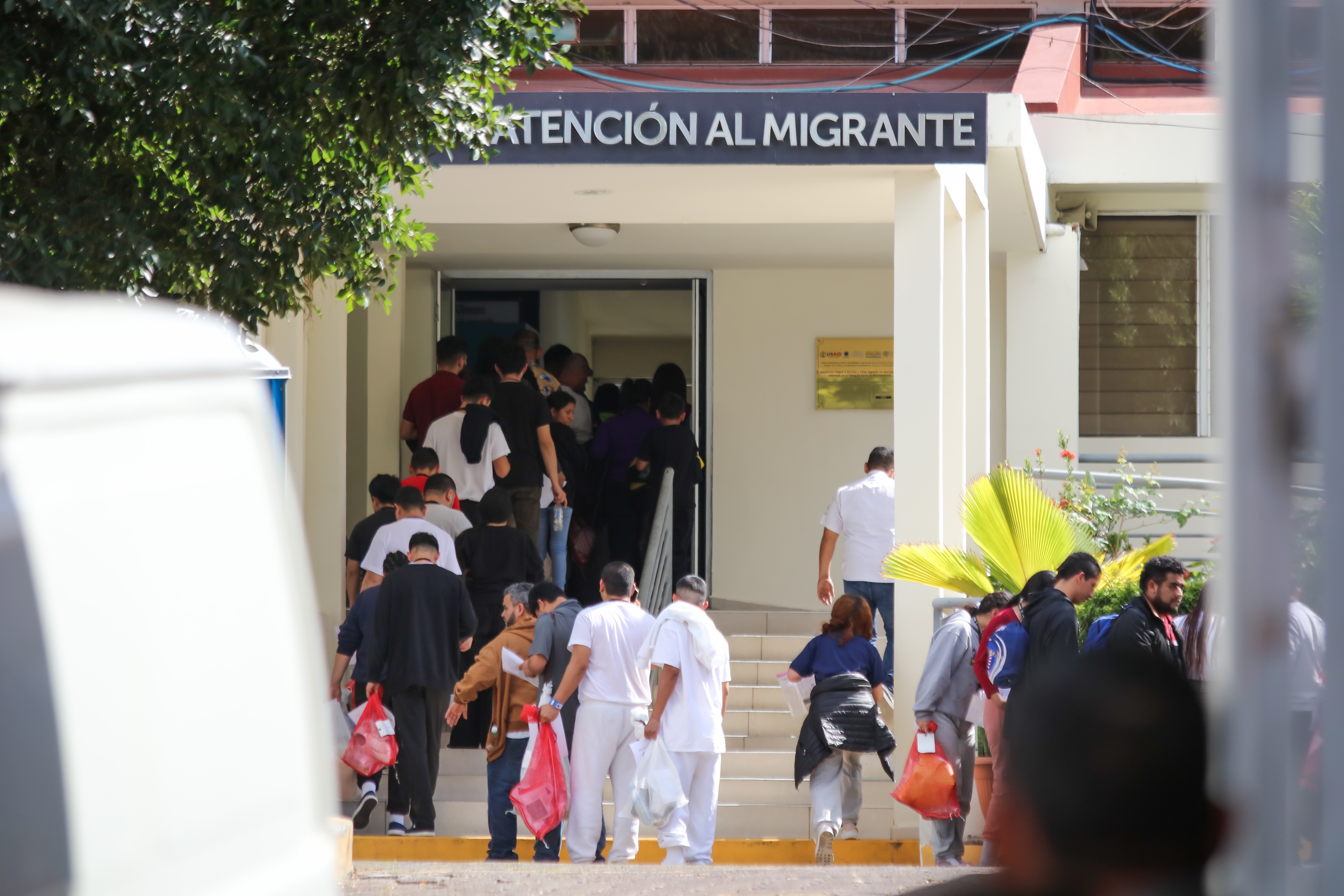 Deported migrants queue to receive an essential items bag during the arrival of a group of deported Salvadorans at Gerencia de Atención al Migrante on Feb. 12, 2025 in San Salvador, El Salvador. (Photo by Alex Peña/Getty Images)