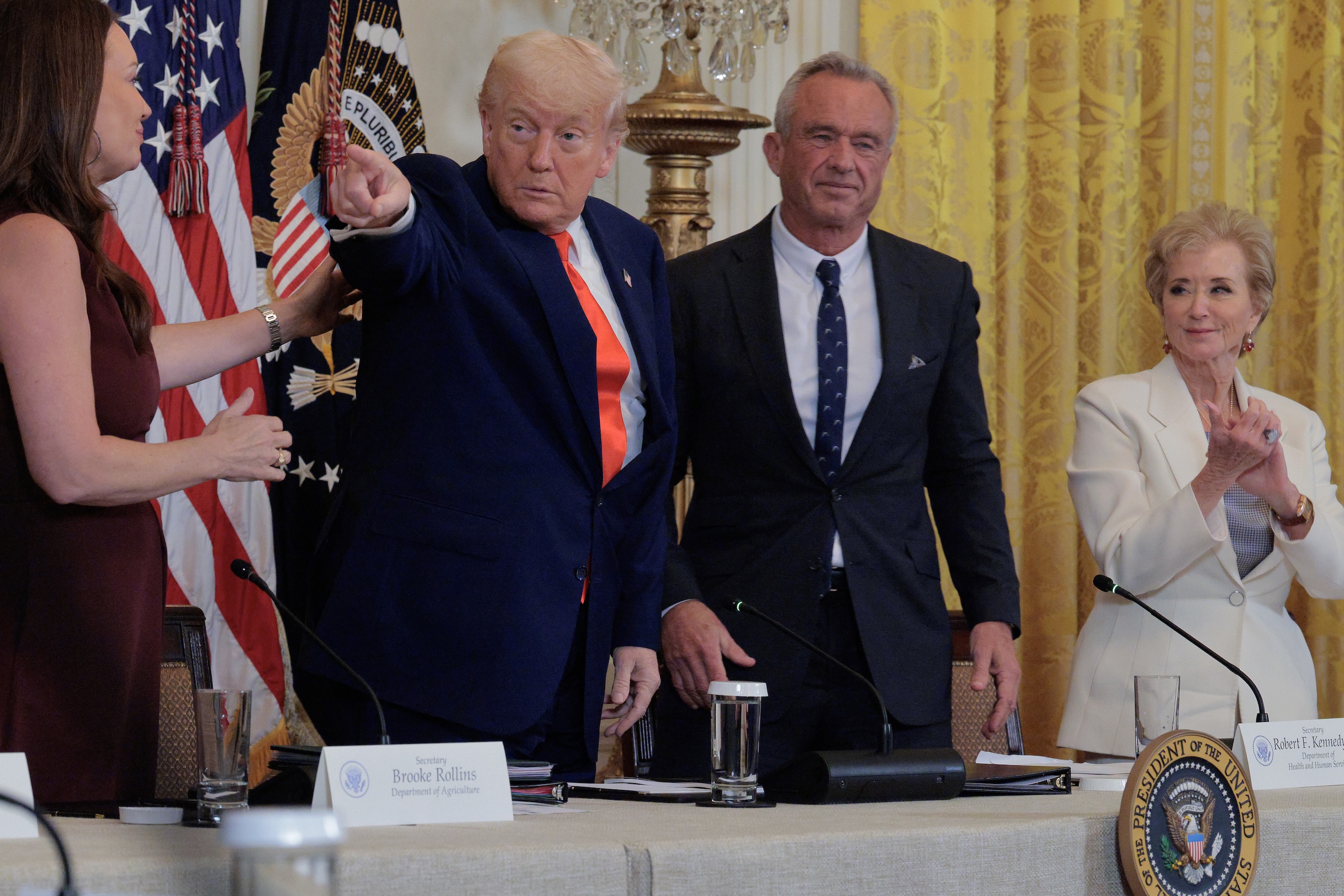 Agriculture Secretary Brooke Rollins, U.S. President Donald Trump, Health and Human Services Secretary Robert F. Kennedy Jr. and Education Secretary Linda McMahon attend an event for the Make America Healthy Again Commission report in the East Room of the White House on May 22, 2025 in Washington, D.C. (Photo by Chip Somodevilla/Getty Images)