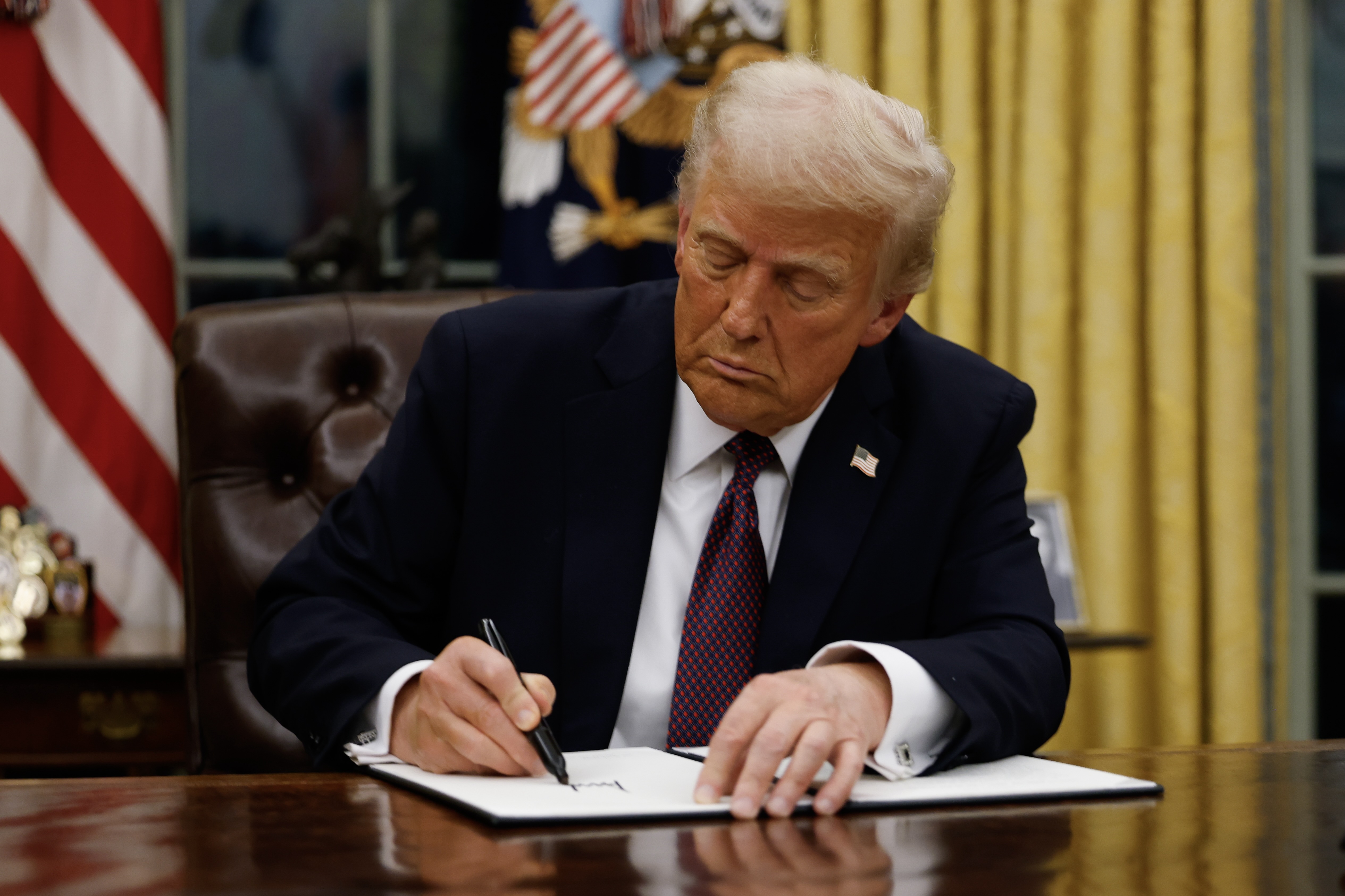 President Donald Trump signs executive orders in the Oval Office of the White House on January 20, 2025 in Washington, DC. Trump takes office for his second term as the 47th president of the United States. (Photo by Anna Moneymaker/Getty Images) President Donald Trump signs executive orders in the Oval Office of the White House on January 20, 2025 in Washington, DC. Trump takes office for his second term as the 47th president of the United States. (Photo by Anna Moneymaker/Getty Images)