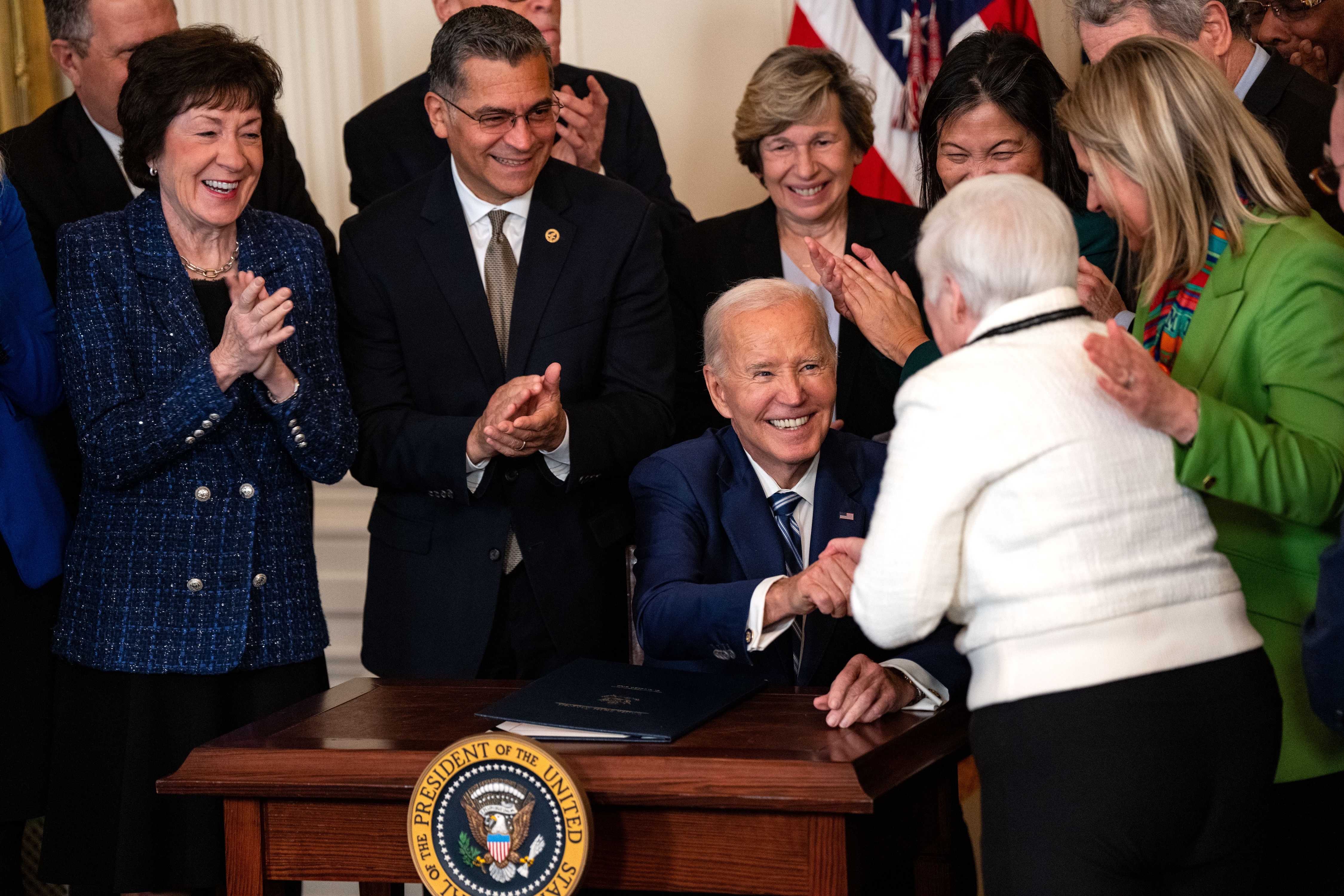 President Joe Biden gives a pen to Bette Marafino, President of the Connecticut Chapter of the Alliance for Retired Americans, after he signed the Social Security Fairness Act during an event in the East Room of the White House on January 5, 2025 in Washington, DC. The legislation will expand Social Security benefits for millions of retired Americans, including firefighters, police officers and teachers. (Photo by Kent Nishimura/Getty Images)