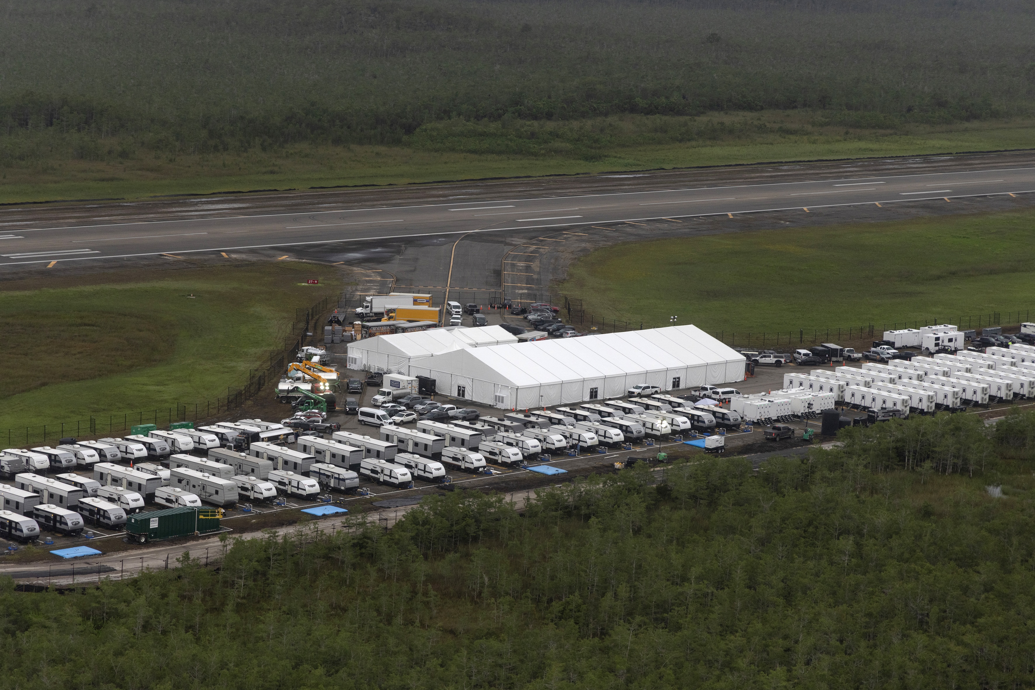 In an aerial view from a helicopter, the migrant detention center dubbed "Alligator Alcatraz" by Florida Republicans is seen at the site of the Dade-Collier Training and Transition Airport on July 4, 2025 in Ochopee, Florida. (Photo by Alon Skuy/Getty Images