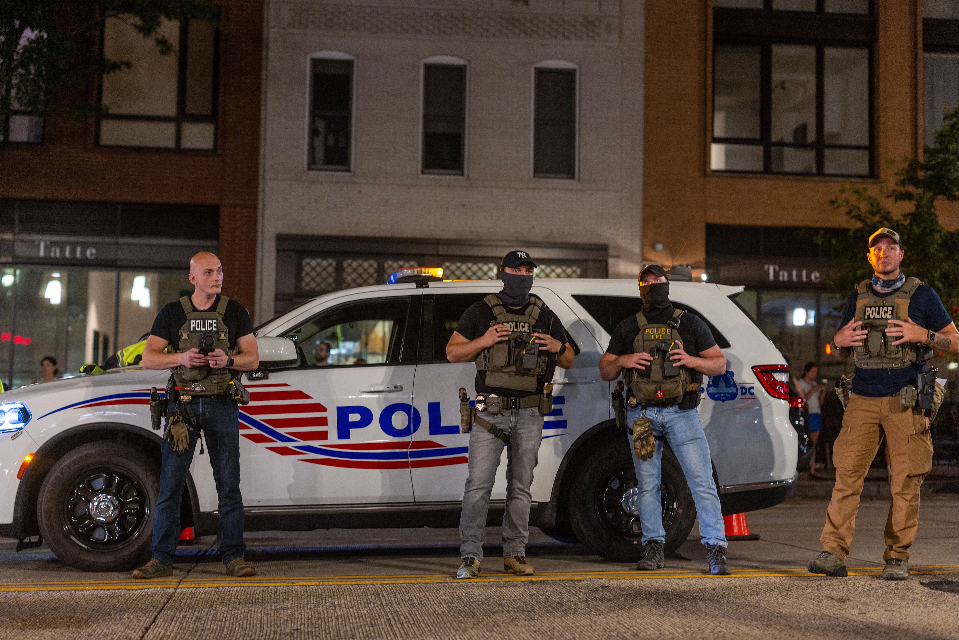 Police officers set up a roadside checkpoint on 14th Street Northwest on Aug. 13, 2025 in Washington, D.C.  (Photo by Tasos Katopodis/Getty Images)