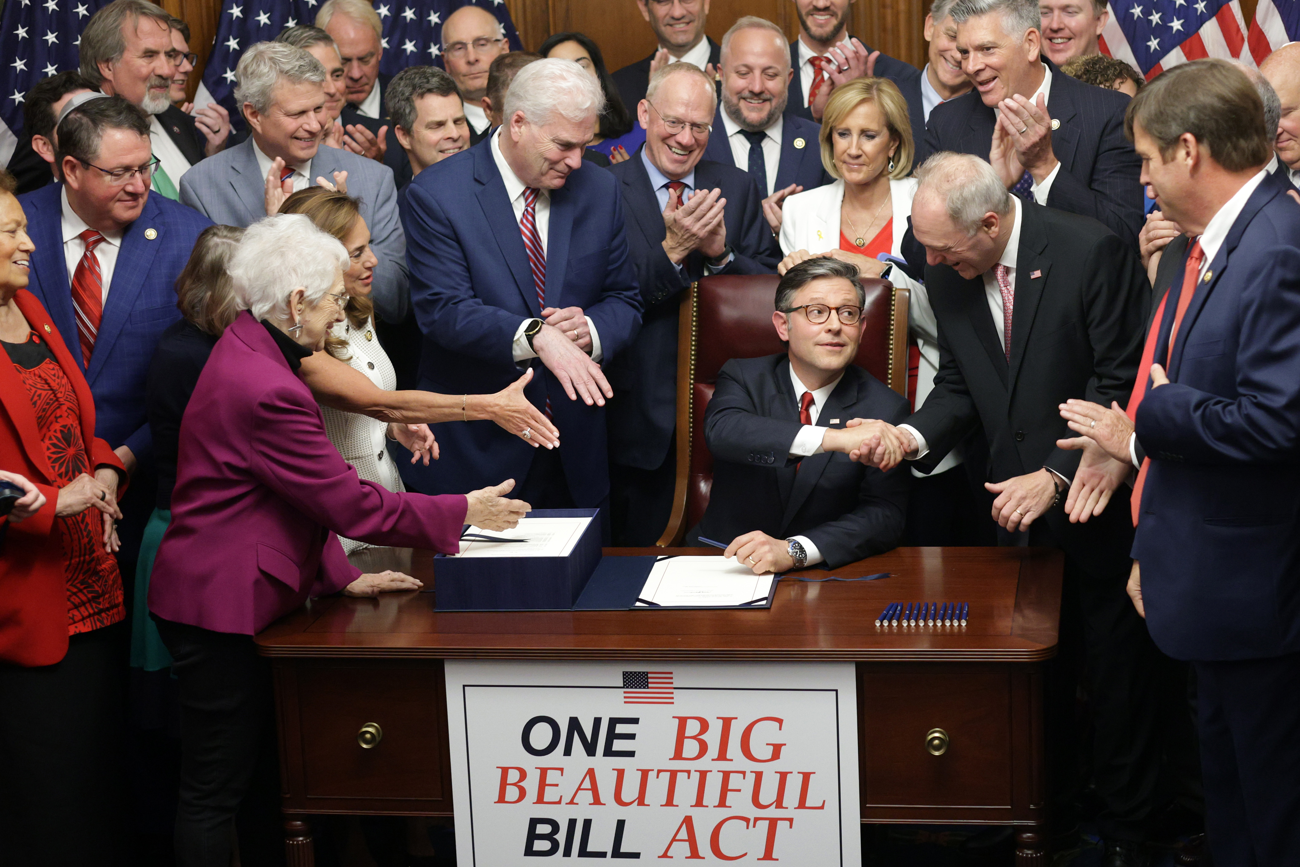 U.S. Speaker of the House Rep. Mike Johnson (R-LA) celebrates with fellow House Republicans during an enrollment ceremony of H.R. 1, the One, Big, Beautiful Bill Act at the U.S. Capitol on July 3, 2025 in Washington, DC. The House passed the sweeping tax and spending bill after winning over fiscal hawks and moderate Republicans. The bill makes permanent President Donald Trump’s 2017 tax cuts, increase spending on defense and immigration enforcement and temporarily cut taxes on tips, while at the same time c