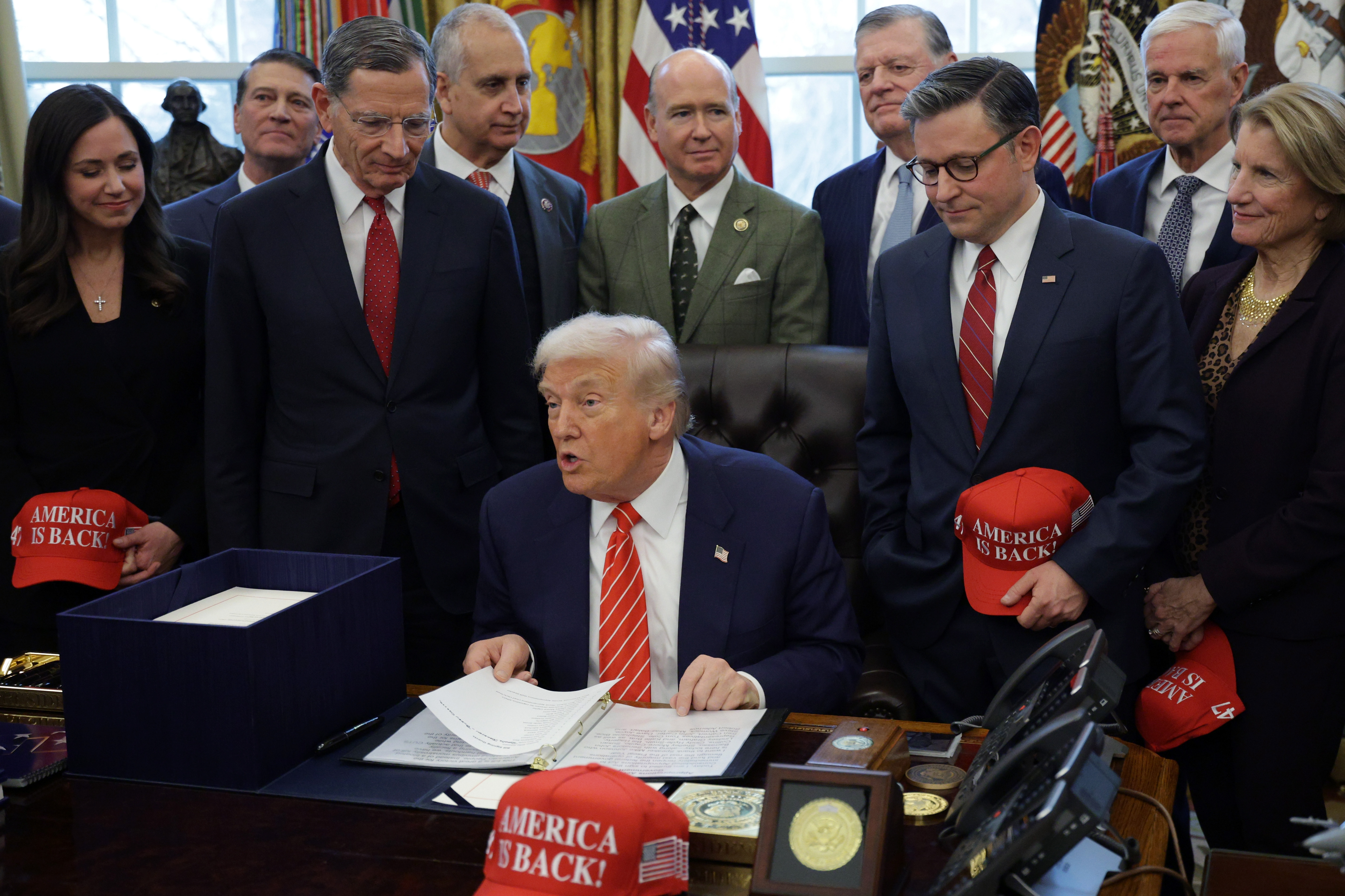 President Donald Trump (C) attends a bill signing in the Oval Office of the White House on February 03, 2026 in Washington, DC. (Photo by Alex Wong/Getty Images)