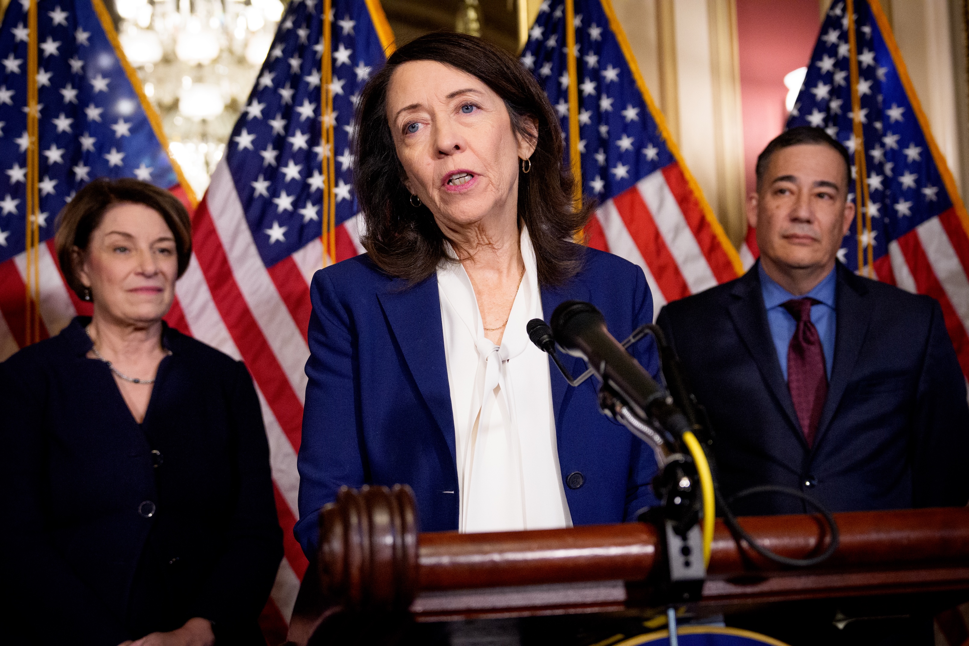 Sen. Maria Cantwell, D-Wash., center, speaks during a news conference at the U.S. Capitol Building on Feb. 24, 2026 in Washington, D.C. At left is Sen. Amy Klobuchar, D-Minn., and at right is Washington Secretary of State Steve Hobbs. (Photo by Andrew Harnik/Getty Images)