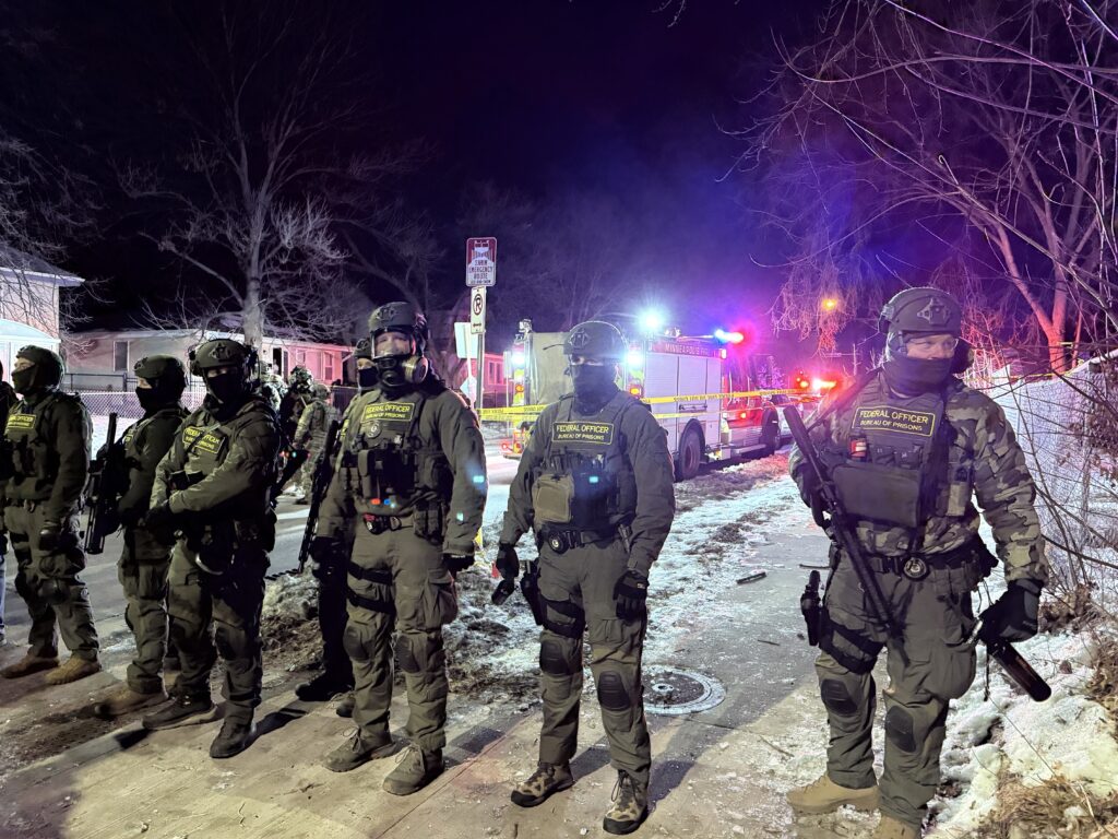 Two men charged with assaulting agents in ICE shooting released by a judge, re-detained by ICE