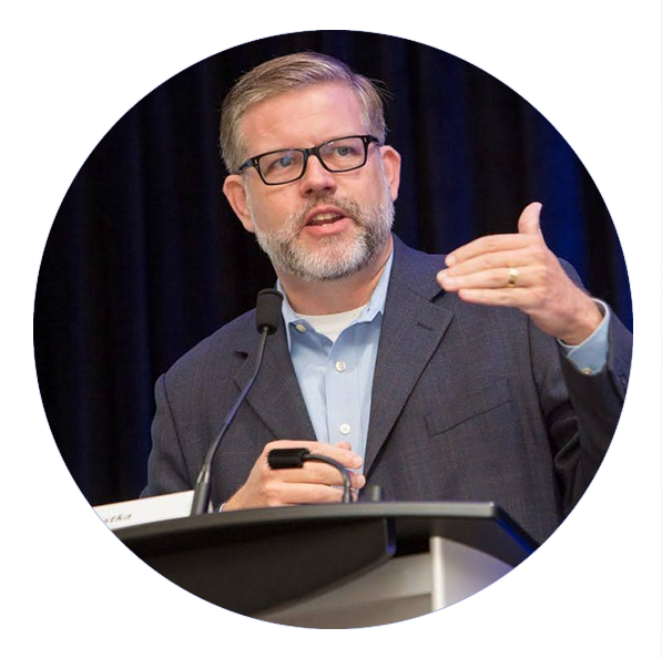 Study: Parents trust librarians despite national push to ban books John Chrastka gestures while speaking at a podium