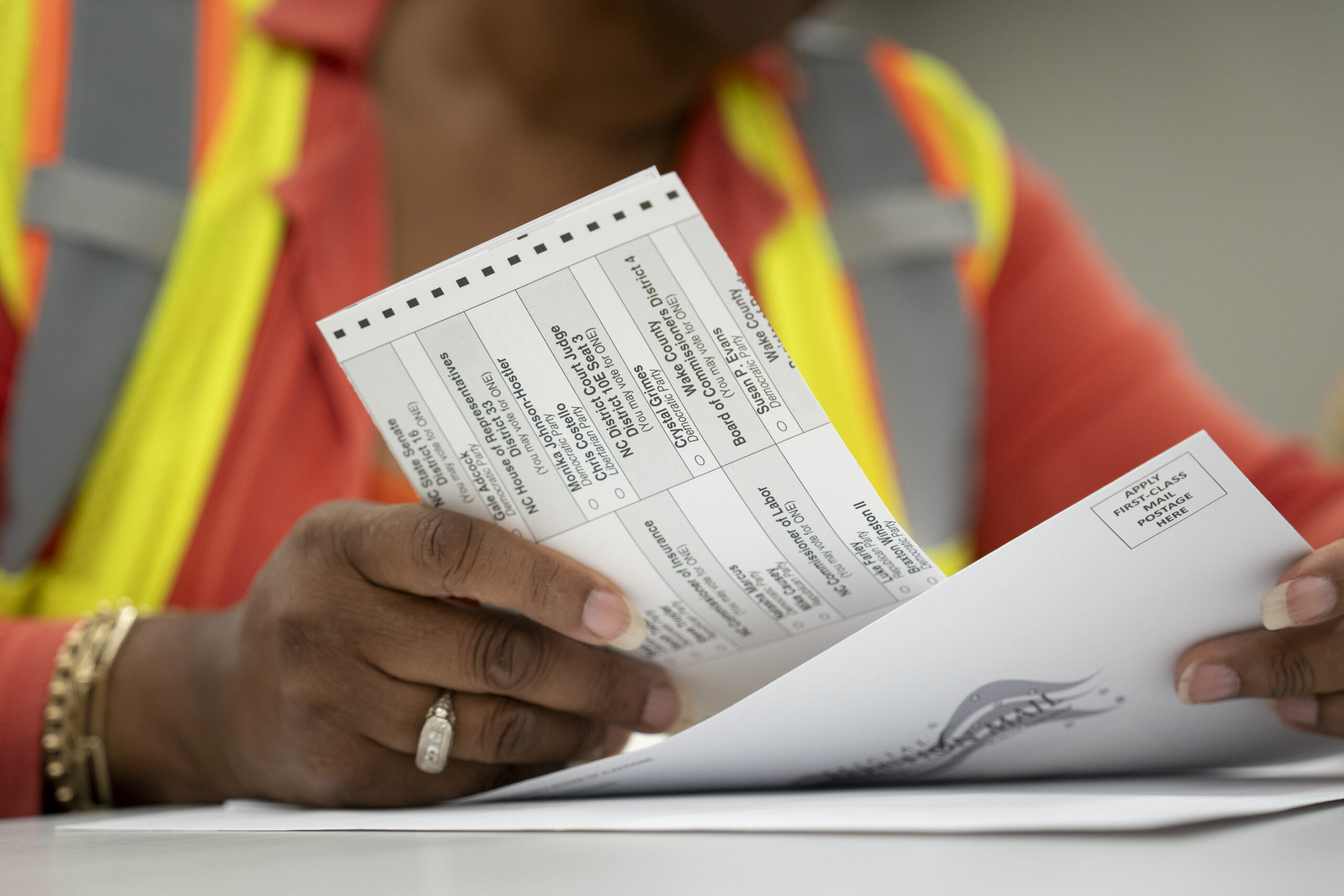 Weekend reads: In a battleground state, it all comes down to voter turnout Absentee ballot being handled by an employee of the Wake County Board of Elections. (Photo by Allison Joyce/Getty Images)