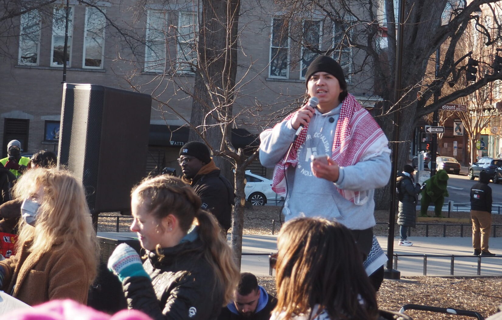 Hundreds protest Trump’s return to office in Raleigh as new resistance takes shape Victor Urquiza, wearing a Party for Socialism and Liberation sweatshirt and a red keffiyeh, speaks at a Moore Square protest against Trump’s return to office.