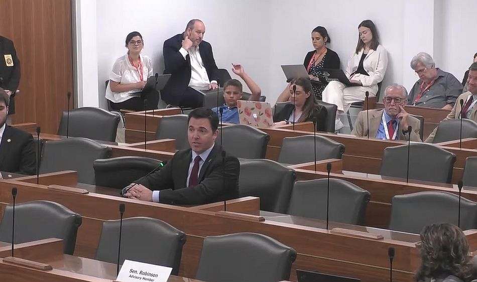 NC Senators advance legislation to regulate synthetic hemp, THC products Attorney General Jeff Jackson with his 10-year-old son seated behind him