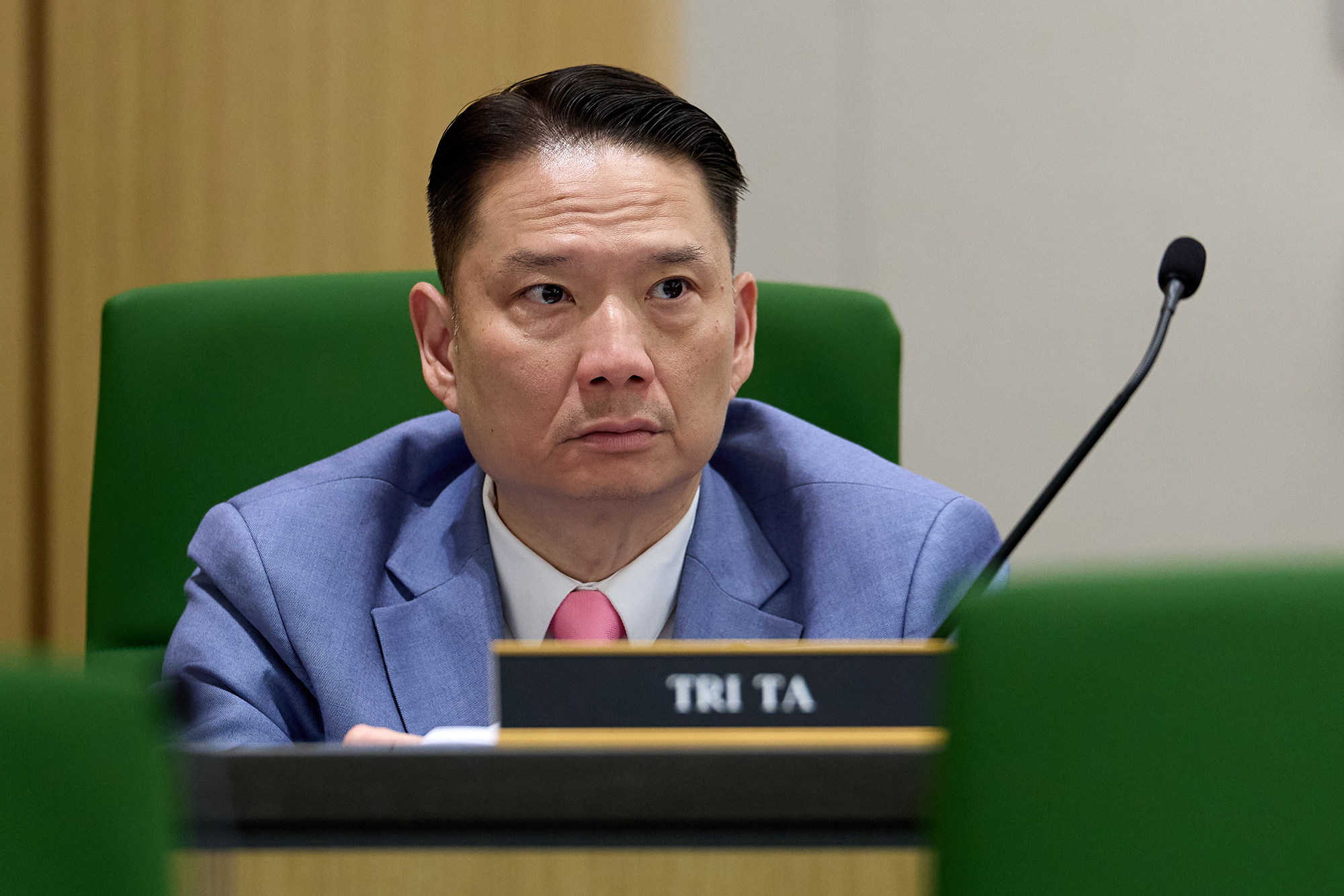 Why nail salons are still being targeted in fights over California gig worker law A close-up view of a lawmaker as they sit behind a dais during a suspense hearing. The lawmaker is seated behind a microphone that faces away from them in a hearing room.