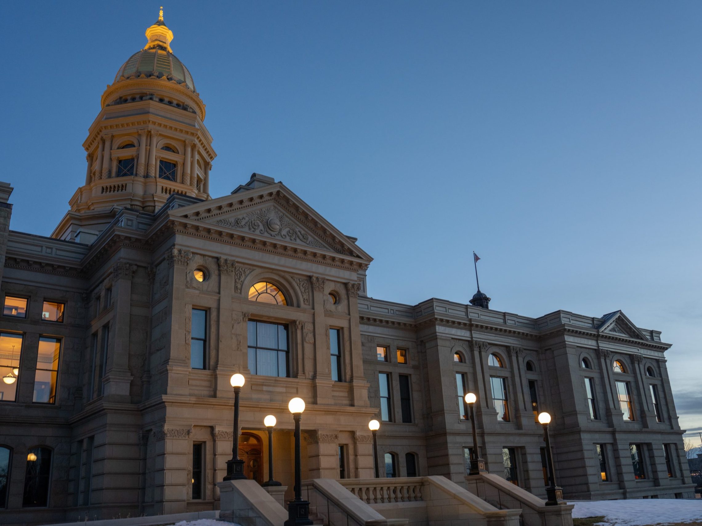Wyoming justice and policing issues to watch this legislative session The Capitol in Cheyenne at dusk with golden lights shining out into the fading daylight. (