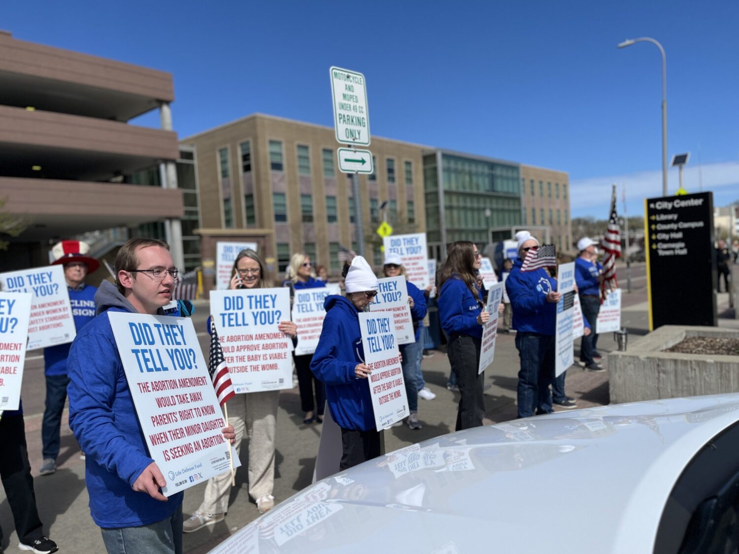 Group submits abortion ballot petitions as opponents pledge legal challenge Anti-abortion protestors with Life Defense Fund outside of the downtown Sioux Falls library on May 1, 2024. (Joshua Haiar/South Dakota Searchlight)