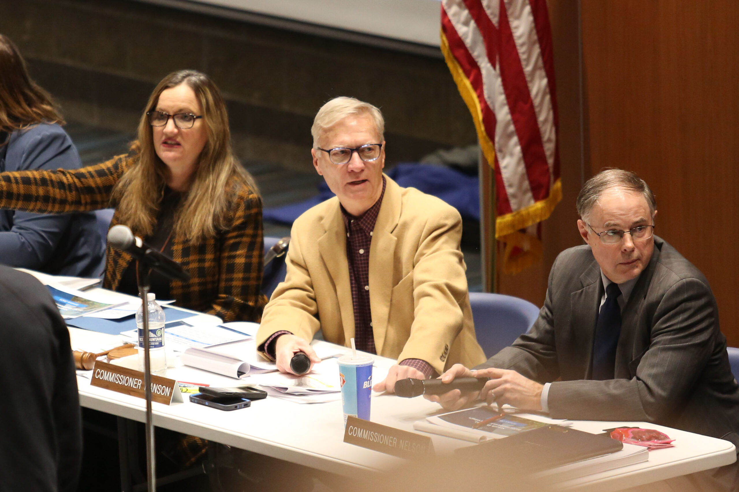 Hundreds crowd public hearing on second attempt at a carbon pipeline permit (From left to right) Public Utilities Commissioners Kristie Fiegen, Gary Hanson and Chris Nelson wait for a public hearing meeting to begin in Sioux Falls on Jan. 15, 2025. (Makenzie Huber/South Dakota Searchlight)