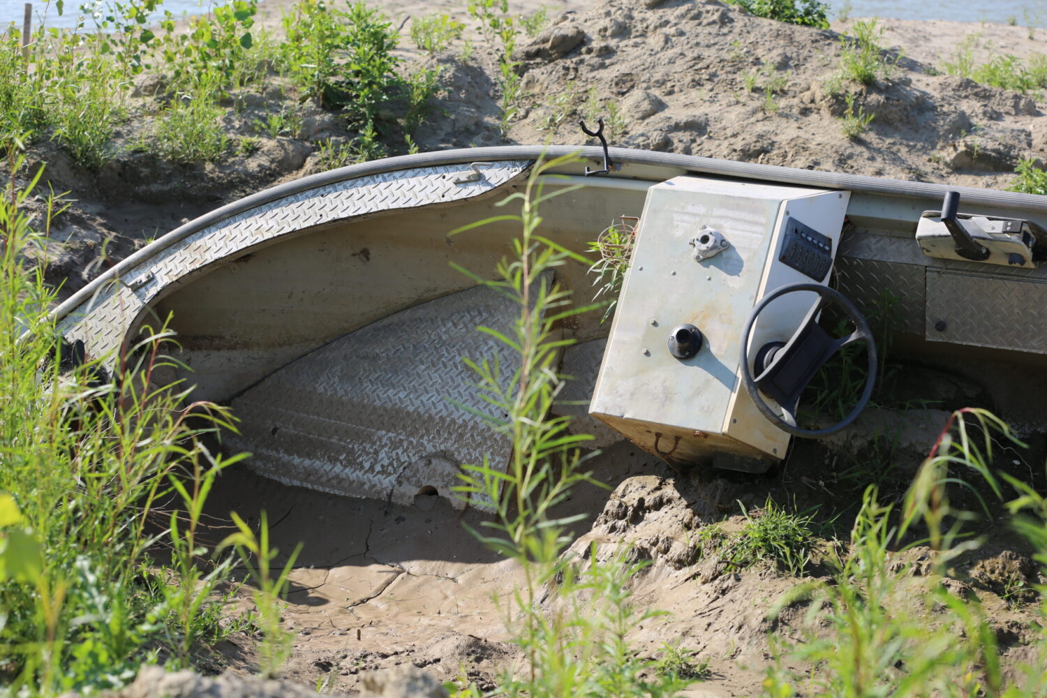 ‘Like we don’t exist’: One year after the flood, a sense of abandonment lingers in McCook Lake A boat lays in the mud along the shores of McCook Lake on June 11, 2025. (Joshua Haiar/South Dakota Searchlight)