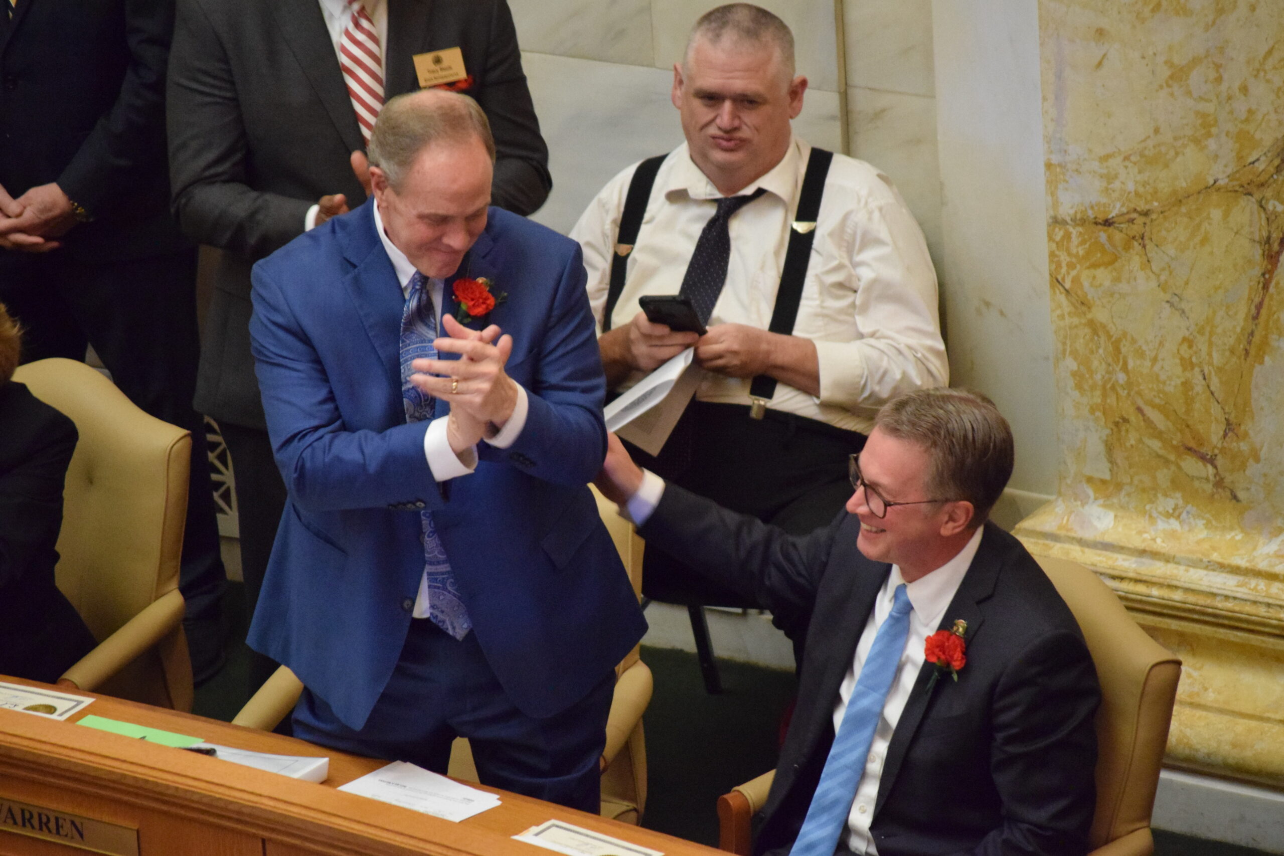 New House Speaker, new and reelected lawmakers ring in Arkansas’ 2025 legislative session Rep. Johnny Rye joins his colleagues in congratulating Rep. Carlton Wing on his new role as Speaker pro tempore on Jan. 13, 2025. (Antoinette Grajeda/Arkansas Advocate)