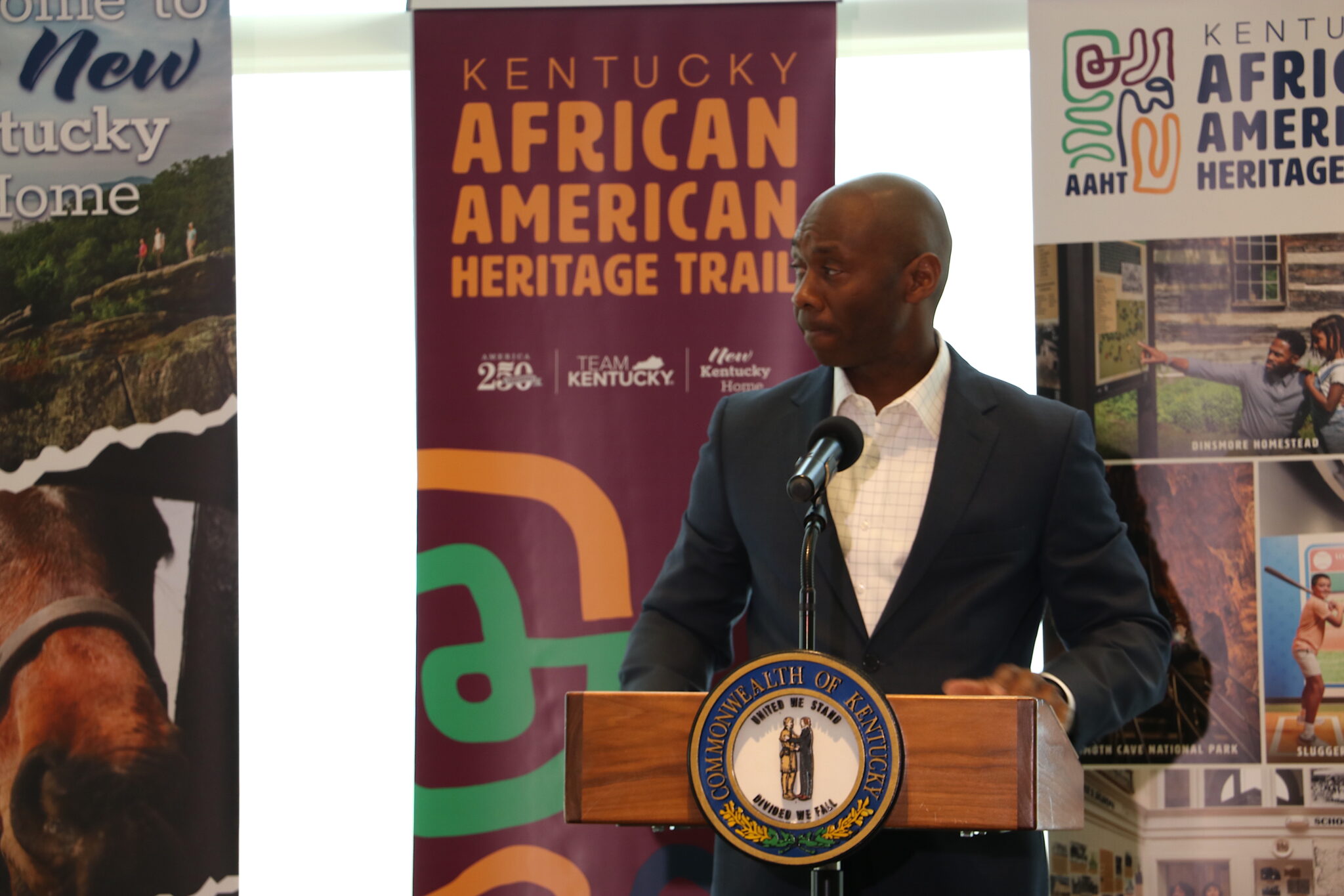 New Kentucky tourism trail showcases Black history and heritage DeVone Holt speaks in front of a podium.