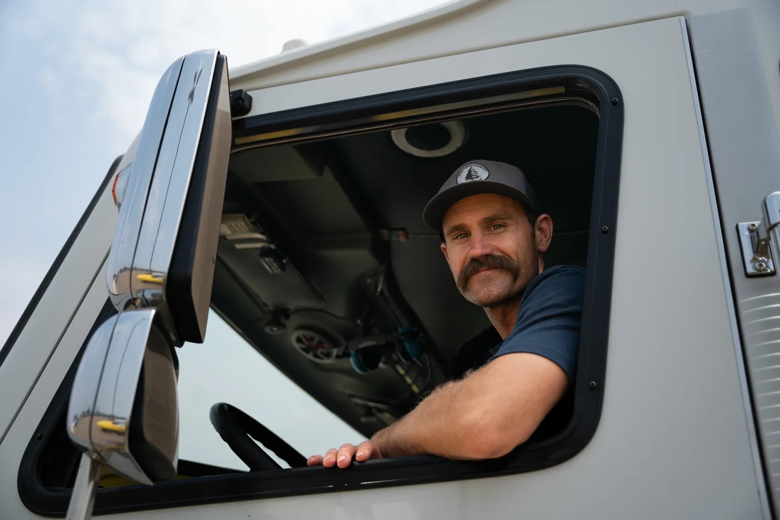 California battles onslaught of wildfires with help from mutual aid Jeff Whitehouse, a Ventura County Fire Department engineer, in his engine at the Park Fire command post in Chico on Aug. 2, 2024. (Photo by Florence Middleton/CalMatters)