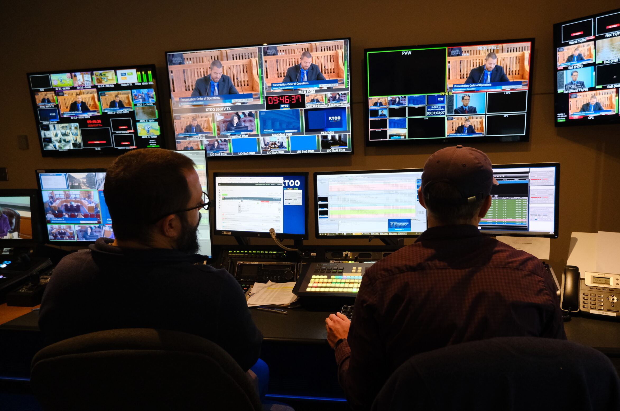 Behind the cameras: Gavel Alaska broadcasts the business of state government to Alaskans Nick Carr, left, and Will Mader, right, manage the broadcast of a presentation by the Department of Revenue to the Senate Finance Committee on Feb 13, 2025 (Photo by Corinne Smith/Alaska Beacon)