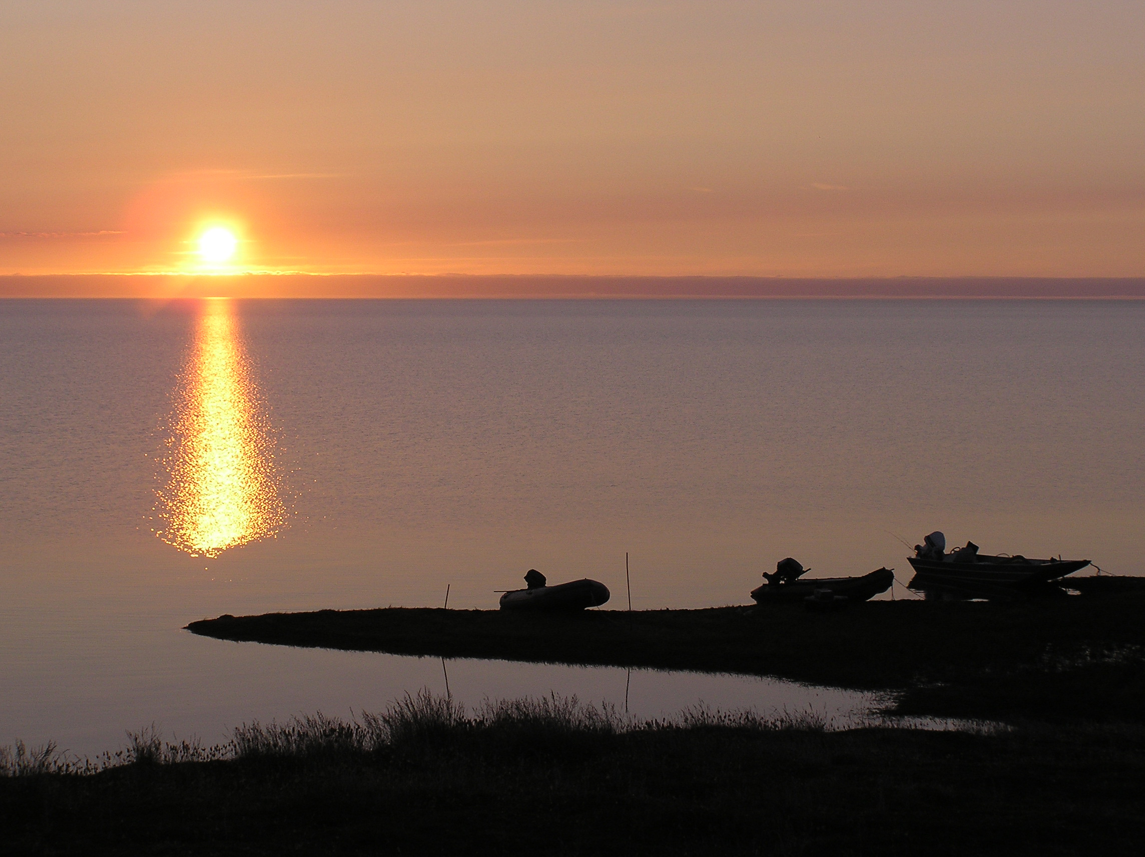 Trump administration revives plan to open most of Arctic Alaska land unit to oil development Researchers' boats are beached on the shore of Teshekpuk Lake in the National Petroleum Reserve in Alaska at sunset in this undated photo. Teshekpuk Lake is the largest lake on the North Slope. (Photo by Tim Craig/U.S. Bureau of Land Management)