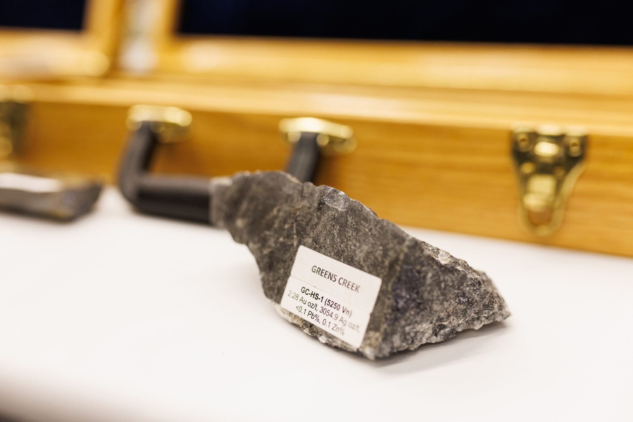 In Canada’s ‘Silicon Valley’ of mining, speculators power a hunt for Alaska’s minerals Exhibits at Roundup included an ore sample from the Greens Creek silver mine outside Juneau. (Photo by Jesse Winter for Northern Journal and Inside Climate News)