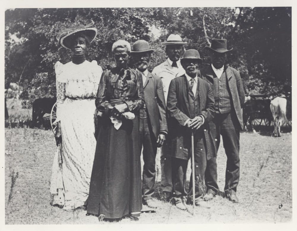 What’s the right way to mark Juneteenth? The newest U.S. holiday is confusing Americans A group of people in fancy dress from the turn of the 19th century, standing together outside.