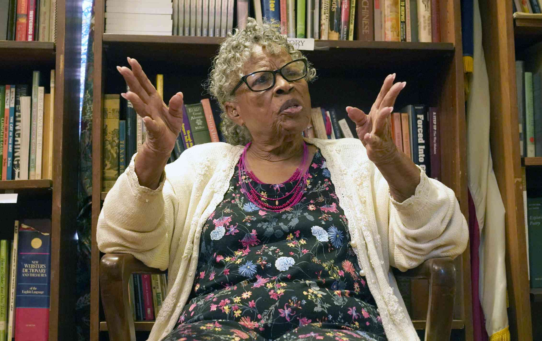 What’s the right way to mark Juneteenth? The newest U.S. holiday is confusing Americans A gray haired woman sitting in a room with bookshelves behind her, gesturing with her hands.