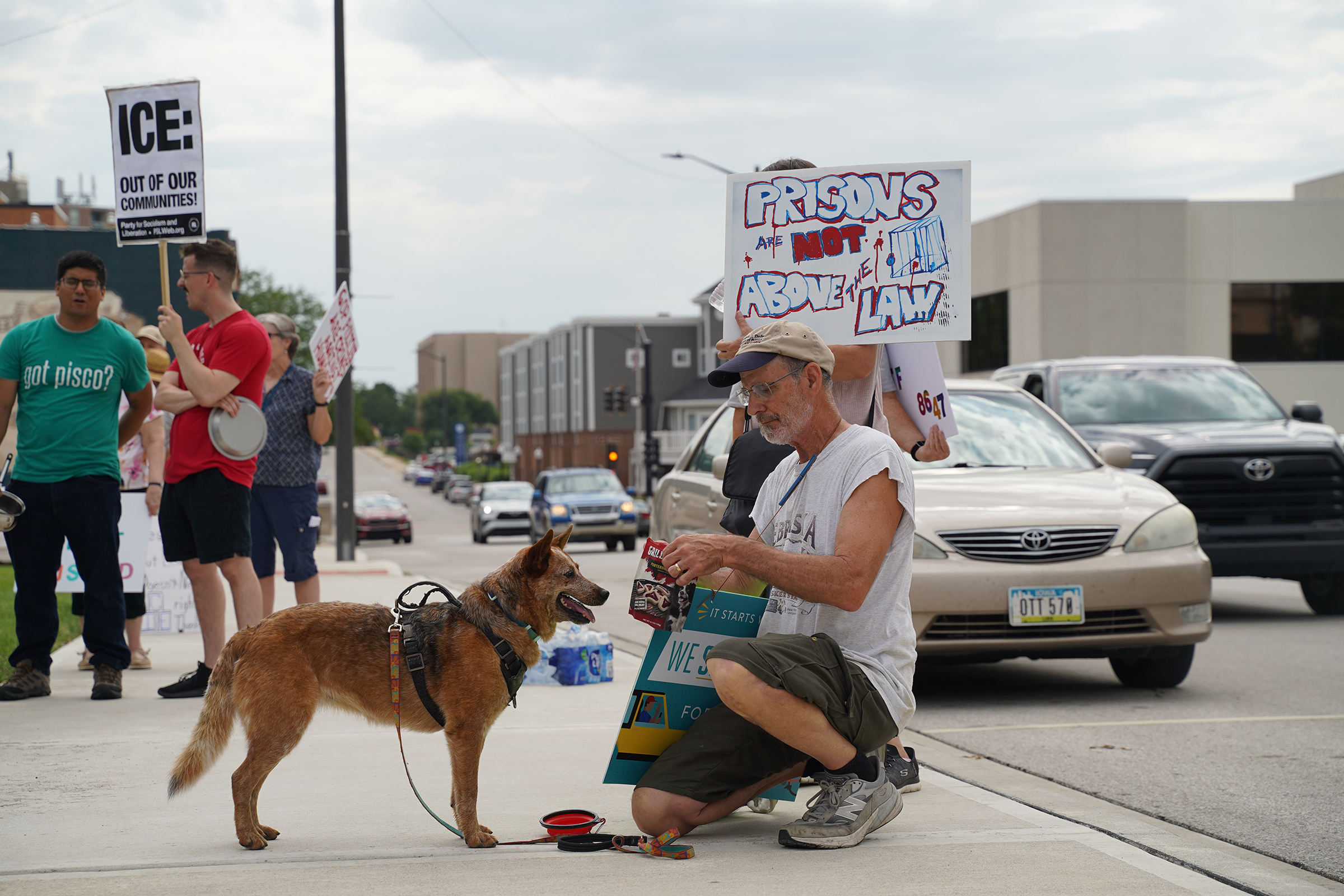 Former CoreCivic workers, Leavenworth residents march against plan to reopen prison as ICE facility A demonstrator hands out dog treats while others hold signs outside Leavenworth City Hall during the July 19, 2025, "pots and pans" march. The CoreCivic Opposition Group of Leavenworth organized the protest of CoreCivic and the for-profit detention of immigrants
