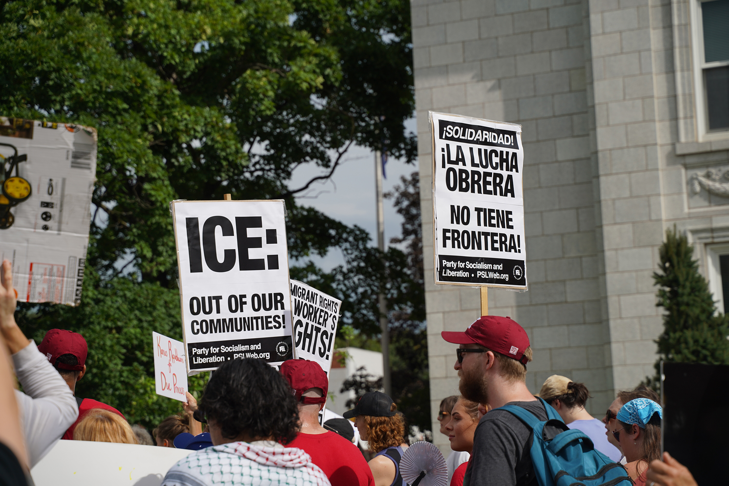 Former CoreCivic workers, Leavenworth residents march against plan to reopen prison as ICE facility Demonstrators hold signs reading “ICE: Out of our communities!” and “¡La lucha obrera no tiene frontera!" ("The workers' struggle has no borders!") during the July 19, 2025, "pots and pans" march in Leavenworth, where demonstrators protested CoreCivic and the for-profit detention of immigrants.