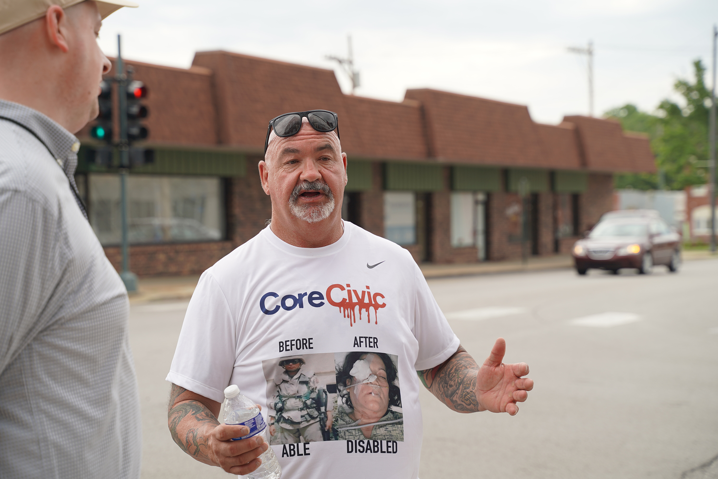 Former CoreCivic workers, Leavenworth residents march against plan to reopen prison as ICE facility William Rogers, who worked at the Leavenworth CoreCivic facility from 2016 to 2020, speaks about his experience at the facility. Rogers wore a graphic shirt with images of injuries sustained by corrections officers while employed by CoreCivic.
