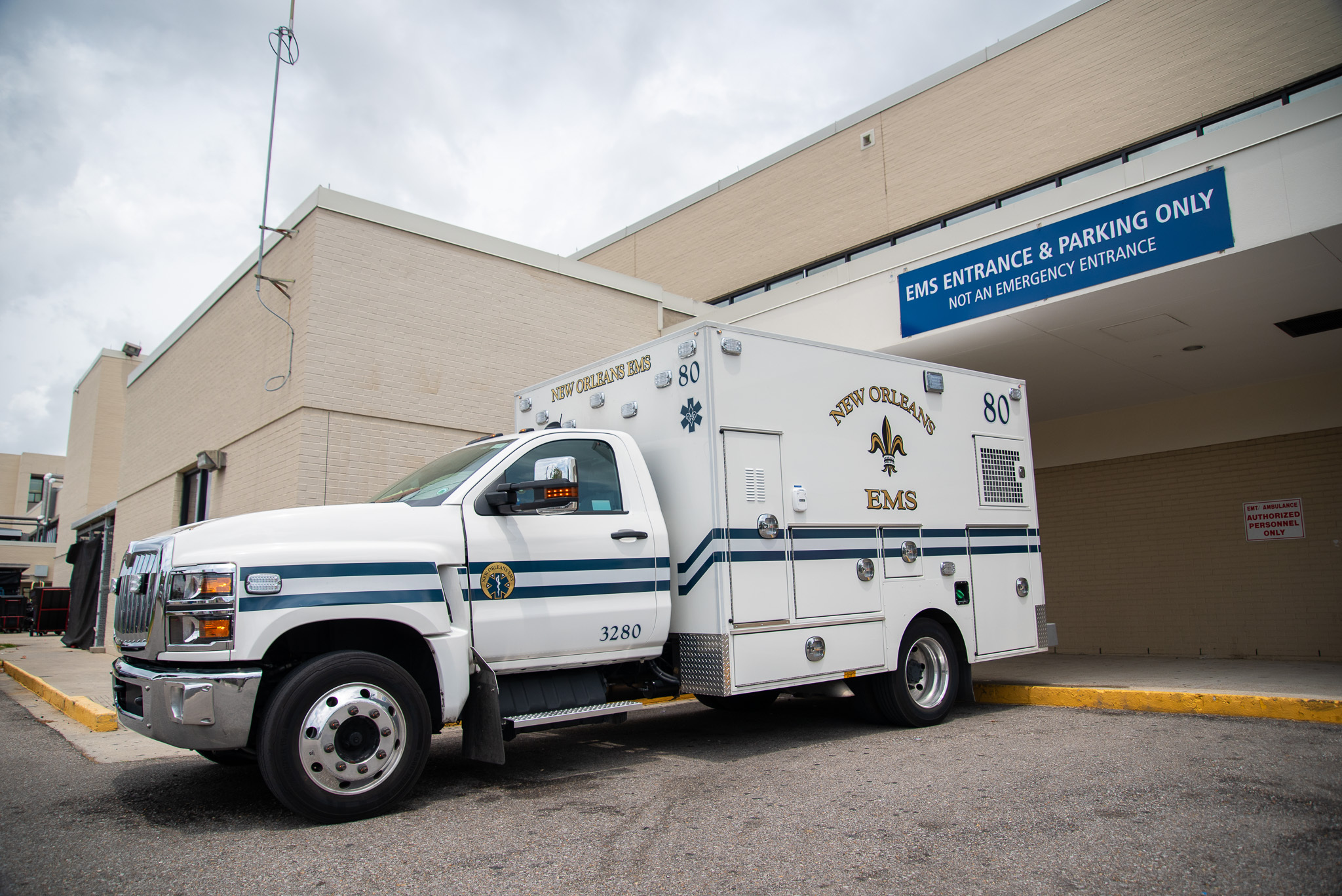 Despite pay problems and staff turnover, New Orleans EMS takes each call in stride A New Orleans EMS ambulance sits parked outside Oschner Medical Center's West Bank campus