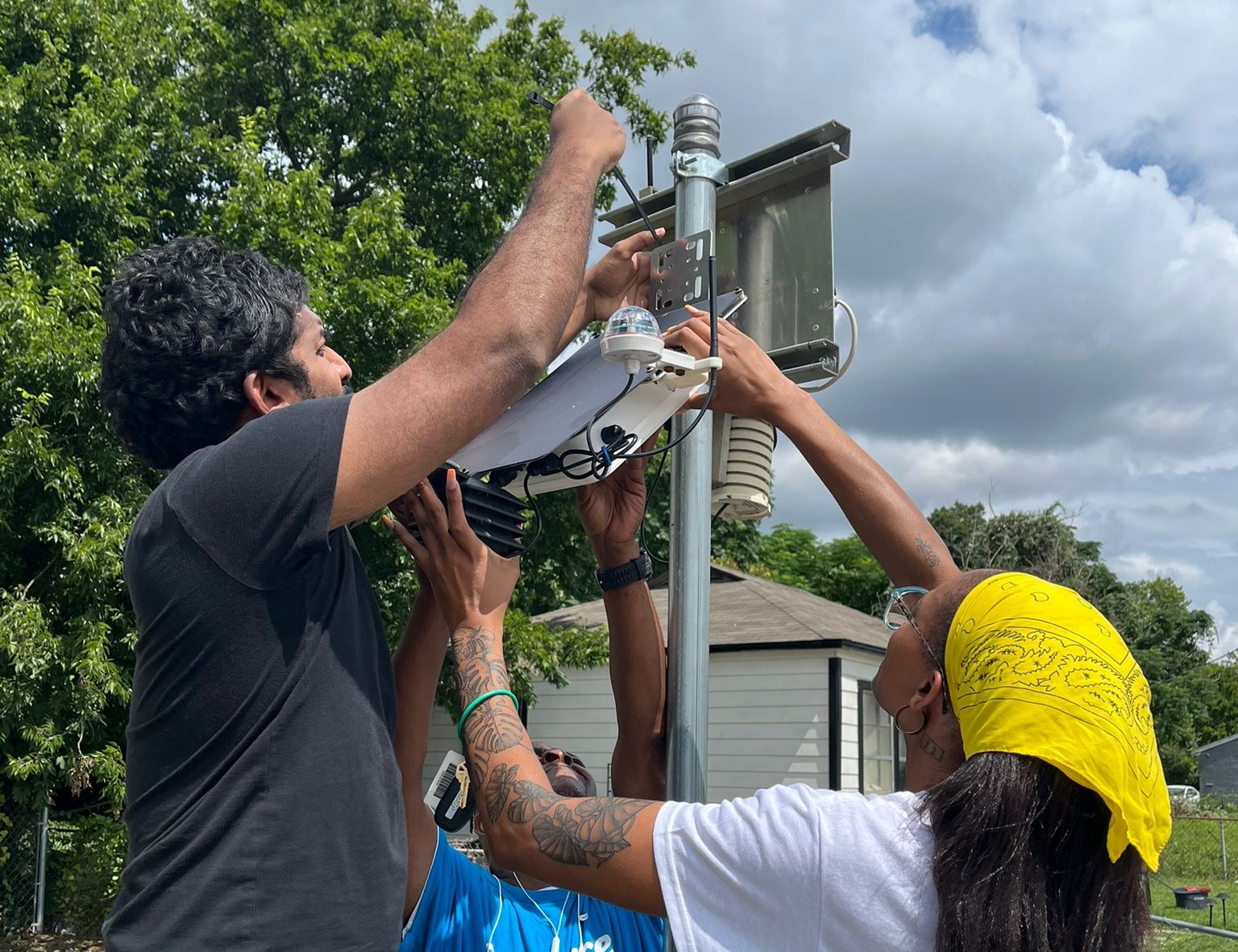 Floods are swallowing their village. The EPA has cut their lifeline. Lakitha Wijeratne and Alicia Kendrick install air-monitoring equipment.