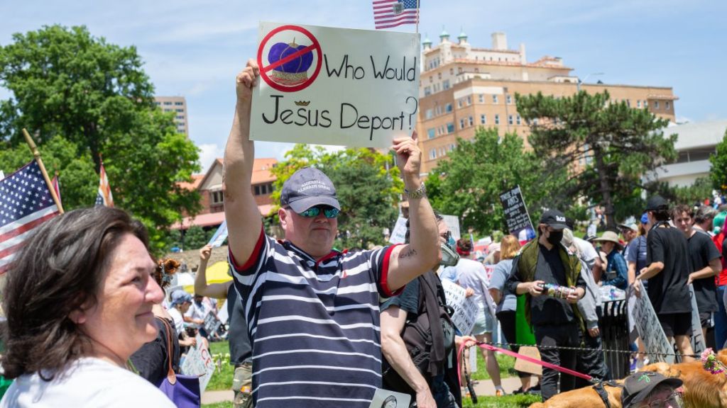 In Kansas City, most immigrants facing deportation receive no legal counsel A protester at the No Kings event.