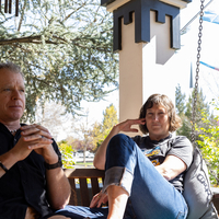Michael and Dr. Angie Devitt sit in front of their home relecting.