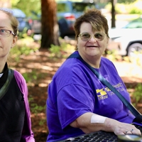 Two individuals sit in Washington talking about their experience with a home health and hospice company.