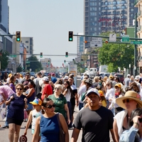 People walk through a festival in Colorado