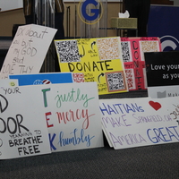 Signs of support for Haitians in Springfield, Ohio, after temporary protected status for Haitians.