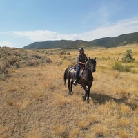 Kathleen Sullivan Kelley of Colorado rides one of her horses at her Rio Blanco County ranch