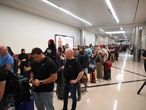 Travelers stand in a long line at Hartsfield-Jackson Atlanta International Airport on Monday, March 23, 2026, the same day federal immigration officials started assisting with airport security. (Photo by Ross Williams/Georgia Recorder)