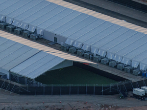 A small outdoor soccer field is located at the end of one of the tent structures at the Camp East Montana ICE detention facility at Fort Bliss in El Paso, Texas on Sept. 7, 2025. (Photo by Paul Ratje for The Texas Tribune)