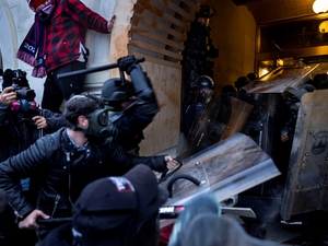 Donald Trump supporters clash with police and security forces in the attack on the US Capitol on Jan. 6, 2021 in Washington, D.C. (Photo by Brent Stirton/Getty Images)