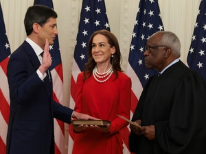 Kevin Warsh, left, takes the oath of office from U.S. Supreme Court Associate Justice Clarence Thomas, right, as Warsh's wife Jane Lauder looks on during his swearing-in ceremony to be the new chairman of the Federal Reserve in the East Room of the White House on May 22, 2026 in Washington, D.C. (Photo by Anna Moneymaker/Getty Images)