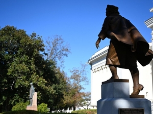 A statue of civil rights activist Rosa Parks is seen from behind on the grounds of the Alabama State Capitol on Nov. 14, 2025 in Montgomery, Alabama. The Alabama Legislature is scheduled to begin a special session on Monday that could eliminate one and possibly more majority-minority or near majority-minority districts. (Brian Lyman/Alabama Reflector)