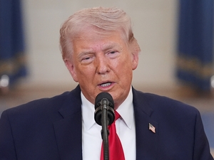 President Donald Trump wants lawmakers to attach the SAVE America Act to unrelated housing and surveillance legislation after it stalled in the U.S. Senate. (Photo by Alex Brandon-Pool/Getty Images)