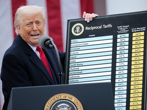 WASHINGTON, DC - APRIL 02: U.S. President Donald Trump holds up a chart while speaking during a “Make America Wealthy Again” trade announcement event in the Rose Garden at the White House on April 2, 2025 in Washington, DC. Touting the event as “Liberation Day”, Trump is expected to announce additional tariffs targeting goods imported to the U.S. (Photo by Chip Somodevilla/Getty Images)