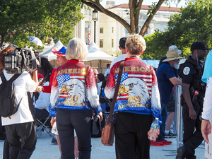 At left, Patti Gordon, 71, of Atlanta, Georgia, walks with her friend from Texas at the Freedom 250 kick-off event in Washington, D.C., on Wednesday, June 24, 2026. (Photo by Ashley Murray/States Newsroom)